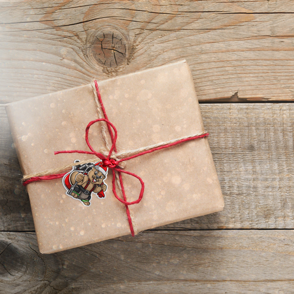 A gift is wrapped using a Santa Beaver Christmas Gift Tag from Sootsoap