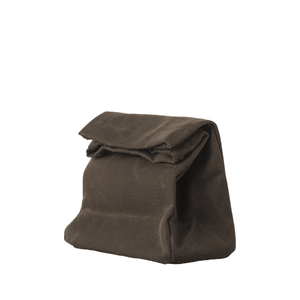 Waxed-cotton mini dopp kit by Well Kept, in dark moss green. Made from durable, water-resistant waxed-cotton, sides roll down for easy access. Snap closure keeps your essentials secure while on the go.